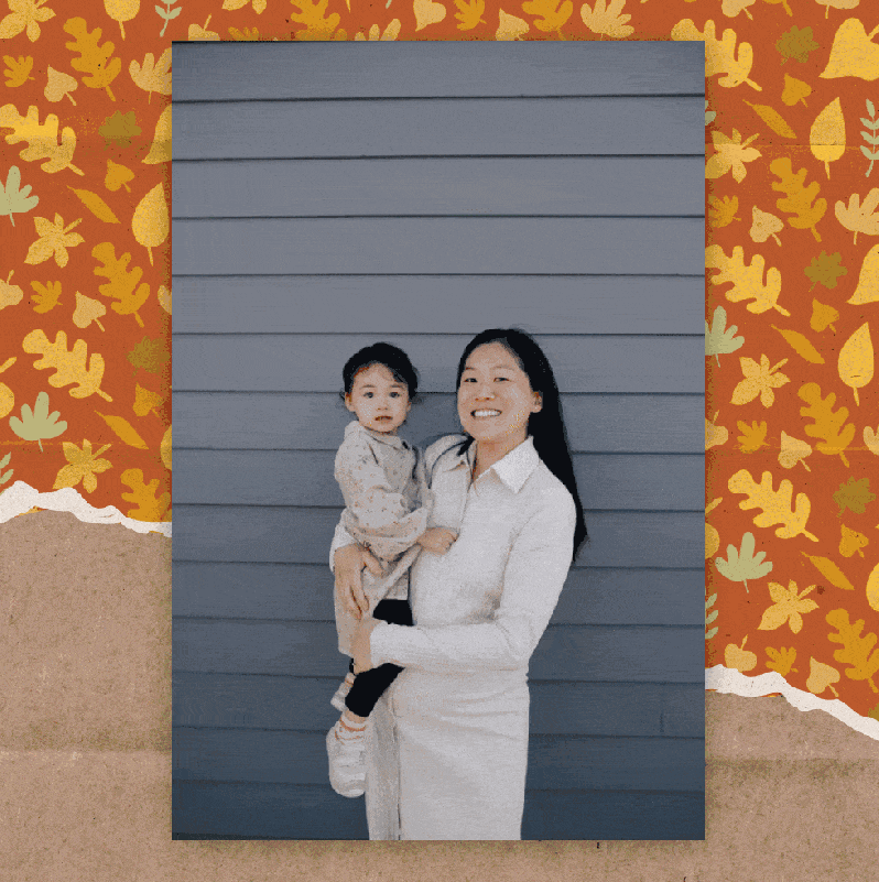 A photograph of a woman holding a baby is shown. The GIF cycles through a photo effects being applied to the image, enhancing the warmth and light to create a "golden hour" effect called autumn glow. The photo is displayed on a screen, with a background of a colorful autumn leaf pattern and a ripped-edge piece of kraft paper. 
