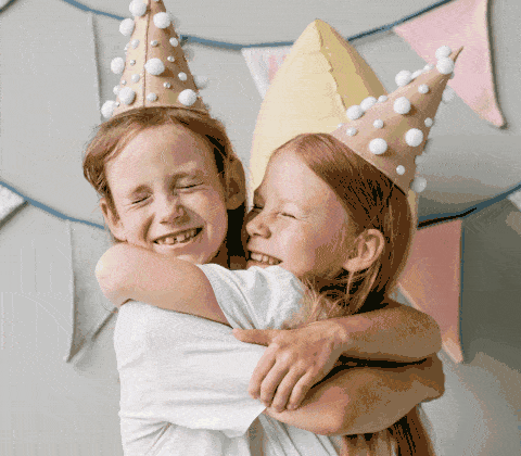 PicCollage magic effect named Bold Tulips that transforms a photo of a 2 little girls hugging into a whimsical and colorful animation.