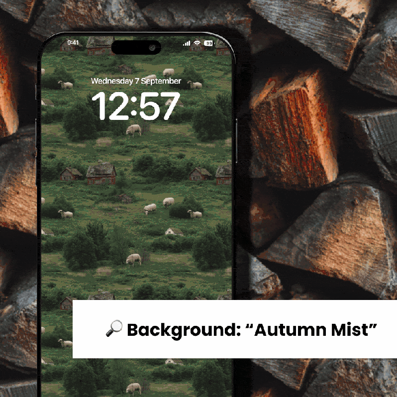 A digital render of a smartphone with a fall-themed wallpaper. The phone is placed at a slight angle on a pile of stacked firewood. The phone's screen displays a stylized, repeating pattern of green rolling hills with small red-roofed houses and white sheep grazing. The time on the phone is 12:57, and the date is Wednesday, 7 September. Below the phone, there is a magnifying glass icon and a text box that reads "Background: 'Autumn Mist'".