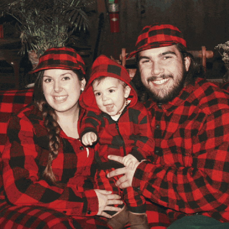 Animated Christmas collage showing a smiling family in matching red‑and‑black plaid as PicCollage Magic Effects add Santa hats, ornament frames, and gift‑wrap backgrounds.